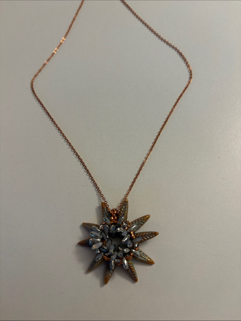 Delicate Rose Gold Sunburst Pendant Necklace - Blue Accents